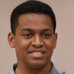 Joyful latino young-adult male with short  brown hair and brown eyes