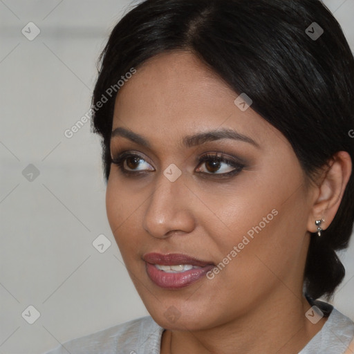 Joyful asian young-adult female with short  brown hair and brown eyes