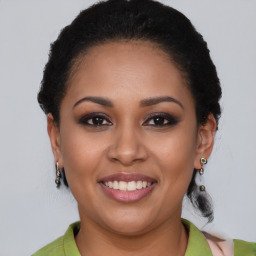 Joyful latino young-adult female with short  brown hair and brown eyes