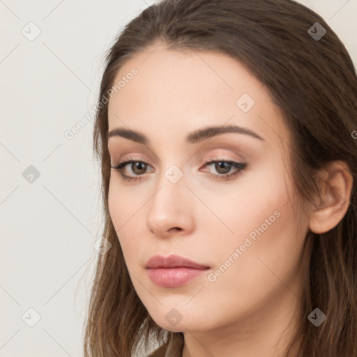 Neutral white young-adult female with long  brown hair and brown eyes