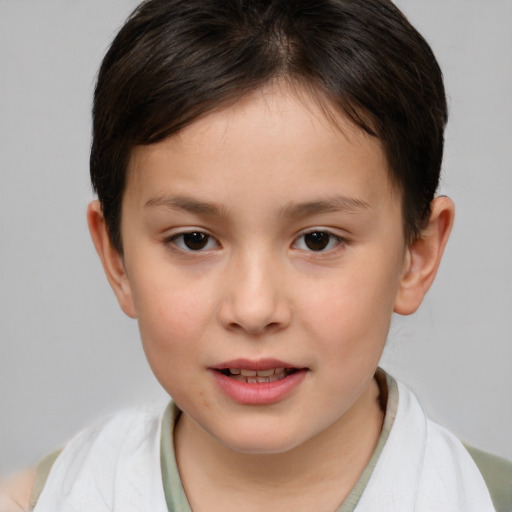 Joyful white child female with short  brown hair and brown eyes