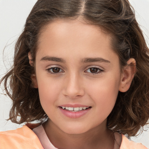 Joyful white child female with long  brown hair and brown eyes