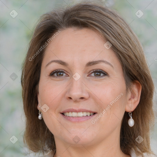 Joyful white adult female with medium  brown hair and grey eyes