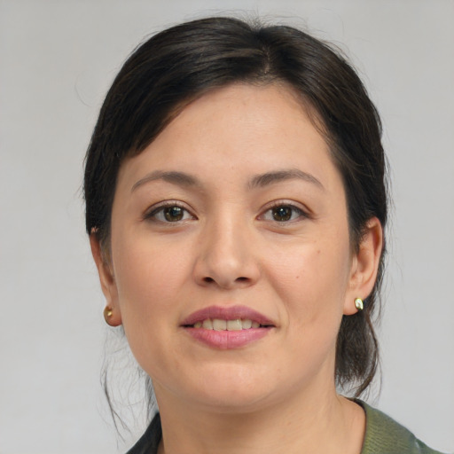 Joyful asian young-adult female with medium  brown hair and brown eyes