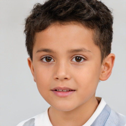 Joyful white child male with short  brown hair and brown eyes