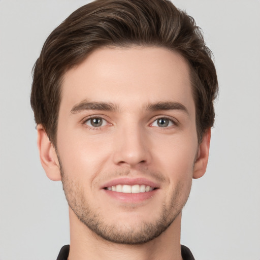 Joyful white young-adult male with short  brown hair and brown eyes