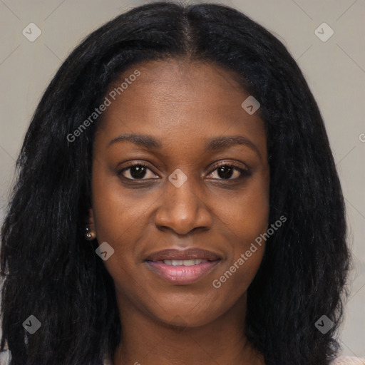 Joyful black young-adult female with long  black hair and brown eyes