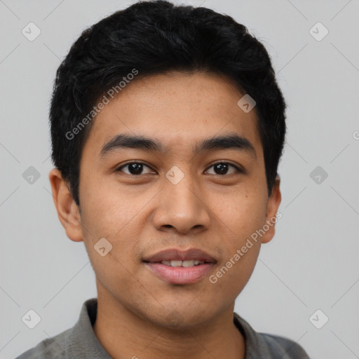 Joyful latino young-adult male with short  black hair and brown eyes