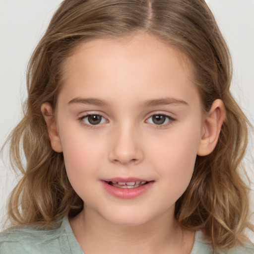 Joyful white child female with medium  brown hair and brown eyes