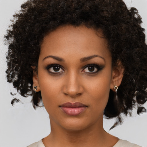 Neutral black young-adult female with medium  brown hair and brown eyes