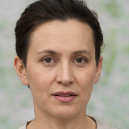 Joyful white adult female with short  brown hair and brown eyes