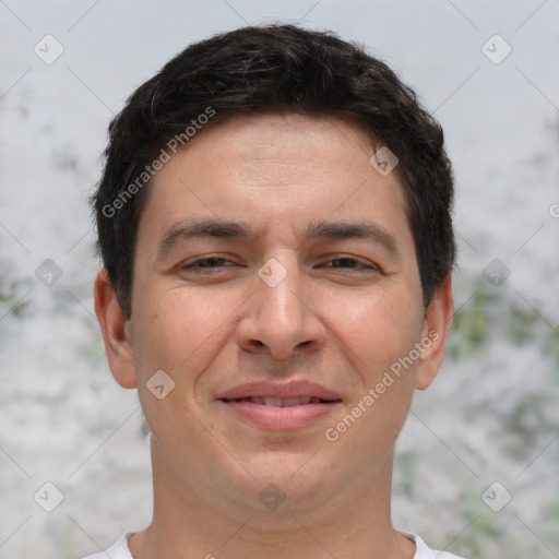 Joyful white adult male with short  brown hair and brown eyes