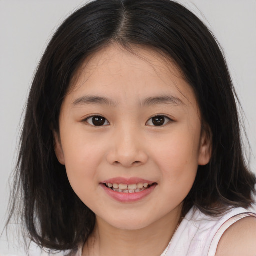 Joyful white child female with medium  brown hair and brown eyes