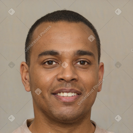 Joyful latino young-adult male with short  brown hair and brown eyes