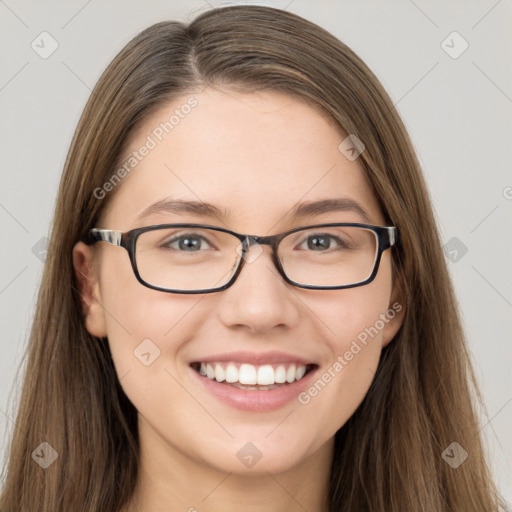 Joyful white young-adult female with long  brown hair and brown eyes