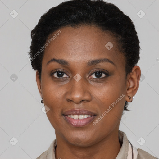 Joyful black young-adult female with short  brown hair and brown eyes