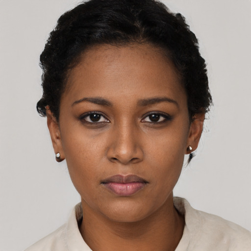Neutral black young-adult female with short  black hair and brown eyes