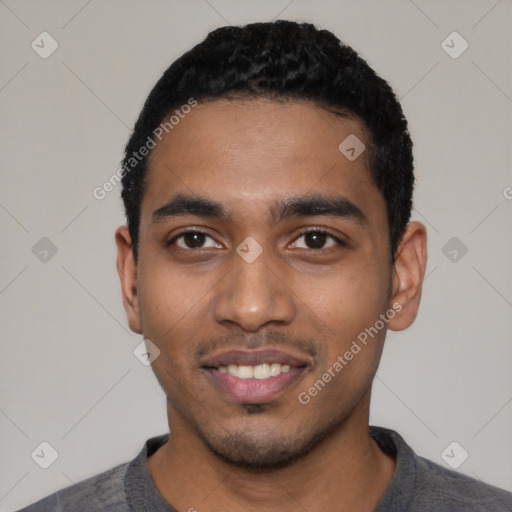 Joyful black young-adult male with short  black hair and brown eyes