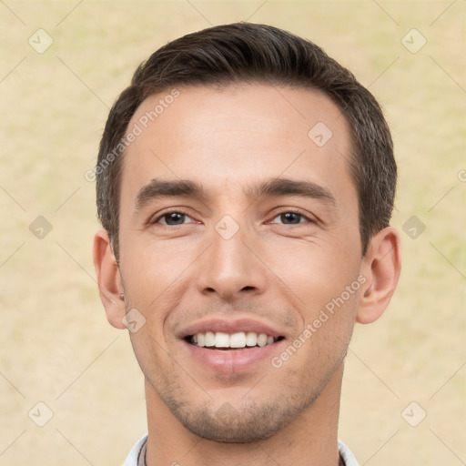 Joyful white young-adult male with short  brown hair and brown eyes