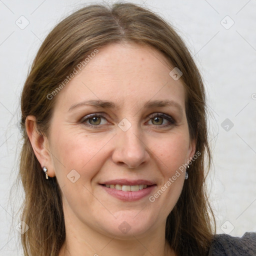 Joyful white adult female with medium  brown hair and grey eyes