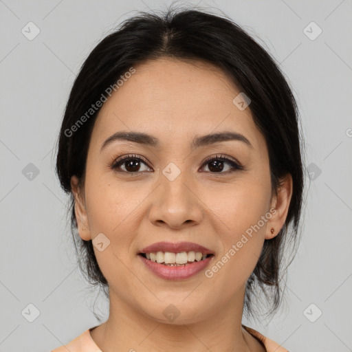 Joyful latino young-adult female with medium  brown hair and brown eyes