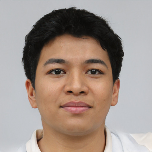 Joyful asian young-adult male with short  black hair and brown eyes