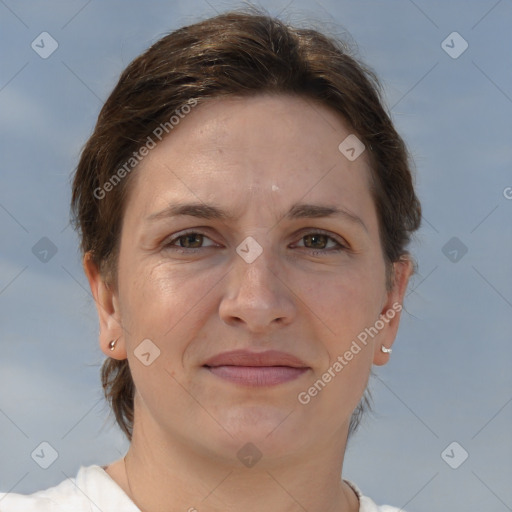 Joyful white adult female with short  brown hair and brown eyes