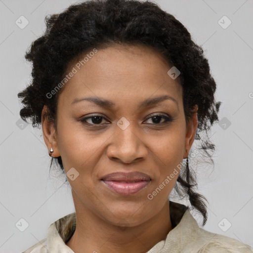 Joyful black adult female with short  brown hair and brown eyes