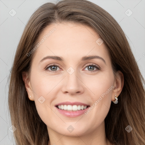 Joyful white young-adult female with long  brown hair and grey eyes