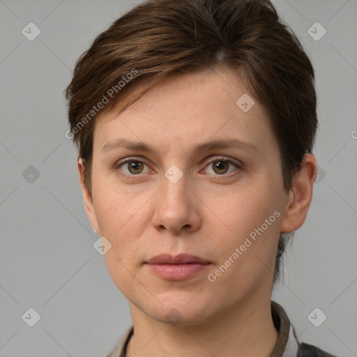 Joyful white adult female with short  brown hair and grey eyes