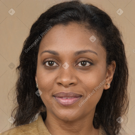 Joyful black adult female with medium  brown hair and brown eyes