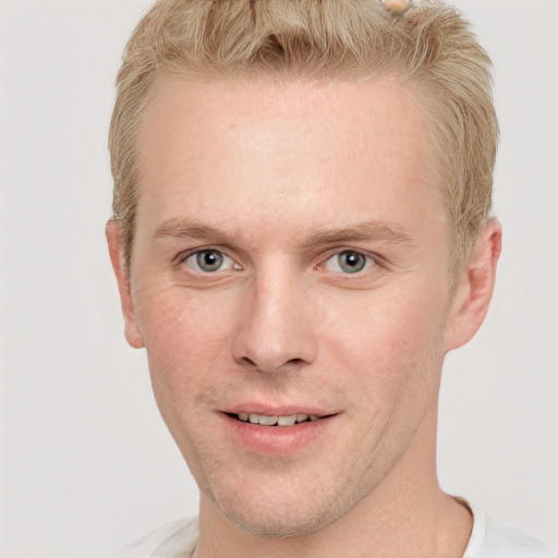 Joyful white adult male with short  brown hair and grey eyes