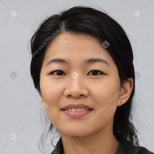 Joyful asian young-adult female with medium  black hair and brown eyes