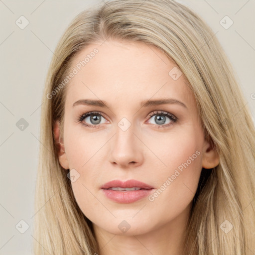 Joyful white young-adult female with long  brown hair and blue eyes