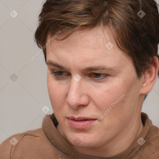 Joyful white adult female with short  brown hair and brown eyes