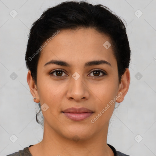 Joyful latino young-adult female with short  brown hair and brown eyes