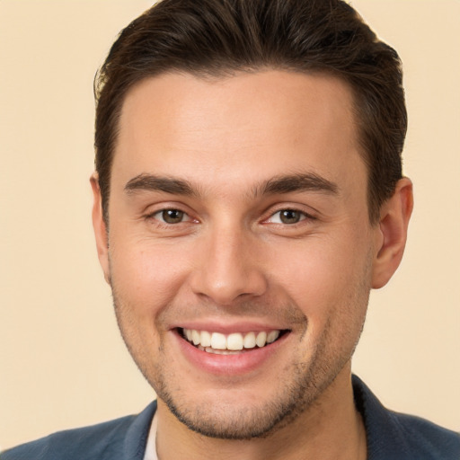 Joyful white young-adult male with short  brown hair and brown eyes