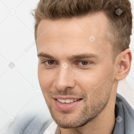 Joyful white young-adult male with short  brown hair and brown eyes