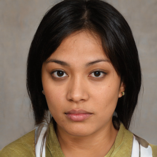 Neutral asian young-adult female with medium  black hair and brown eyes