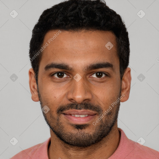 Joyful black young-adult male with short  black hair and brown eyes