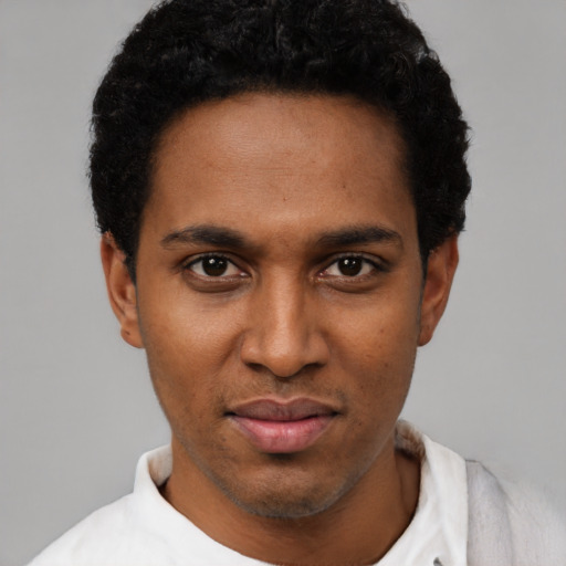 Neutral black young-adult male with short  black hair and brown eyes