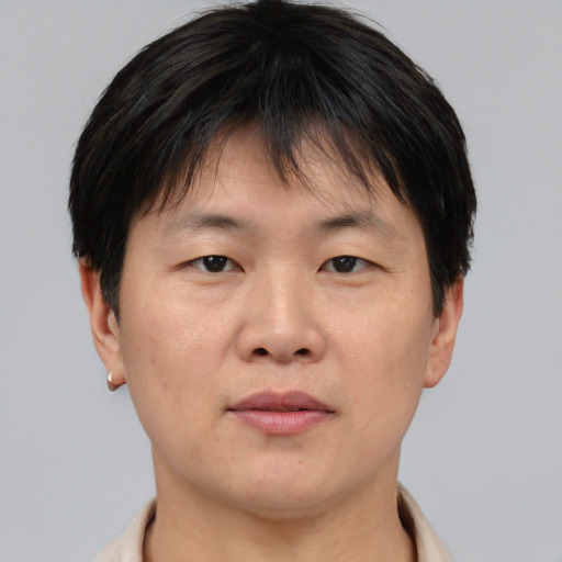 Neutral asian young-adult male with short  brown hair and brown eyes