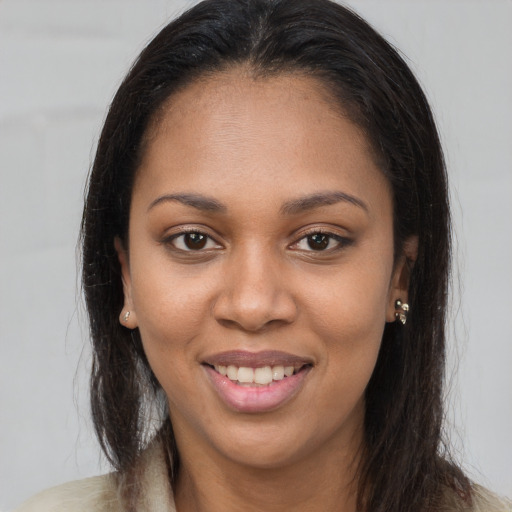 Joyful latino young-adult female with long  brown hair and brown eyes