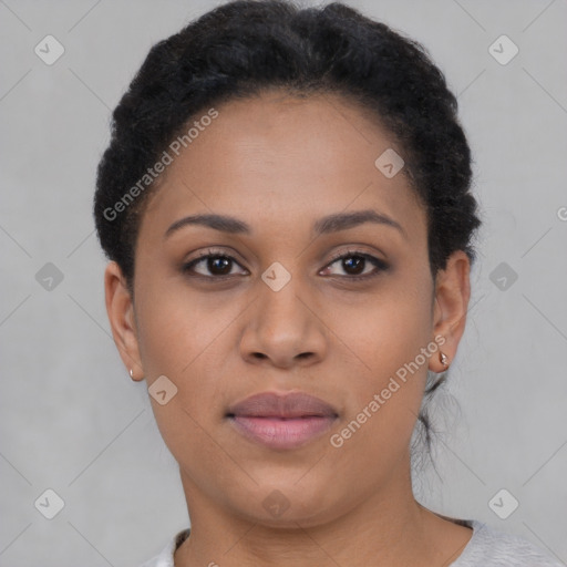 Joyful black young-adult female with short  brown hair and brown eyes