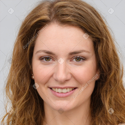 Joyful white young-adult female with long  brown hair and green eyes