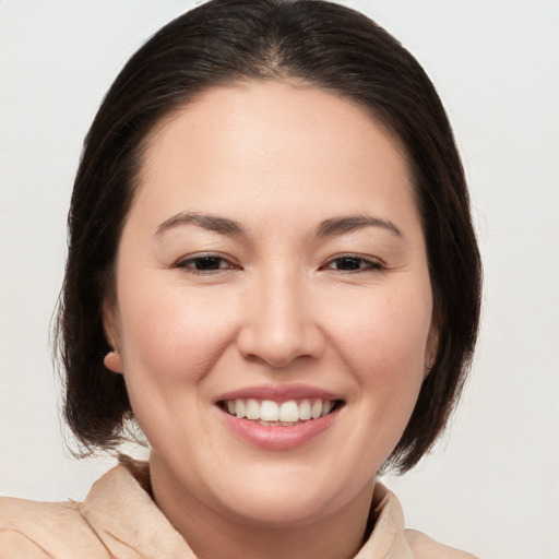 Joyful white young-adult female with medium  brown hair and brown eyes