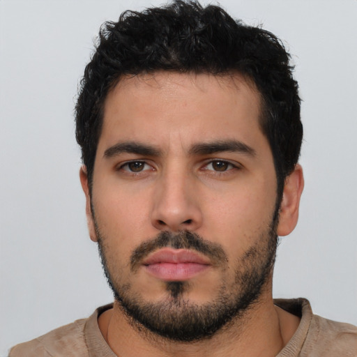 Neutral white young-adult male with short  black hair and brown eyes