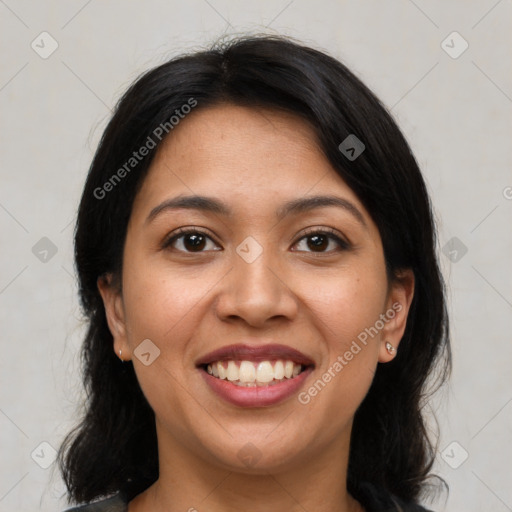 Joyful latino young-adult female with medium  brown hair and brown eyes