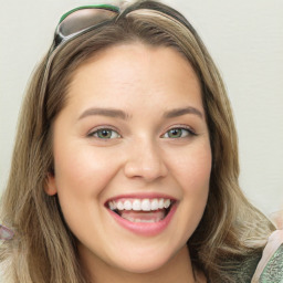 Joyful white young-adult female with medium  brown hair and green eyes