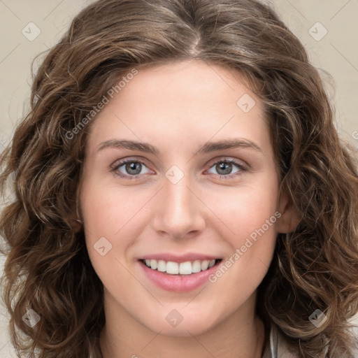 Joyful white young-adult female with long  brown hair and green eyes